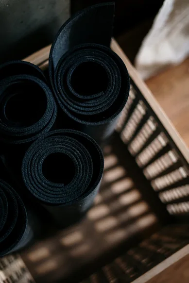 Rolled mats stacked in a basket